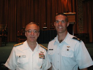 Adm. Shuford honors Maj. Chad J. Davis, USAF, for placing first in his category with his essay Toward Improved Operational Command and Control of Space Weapons.